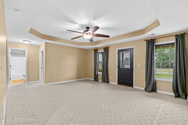 103 Maggie Ln, Bardstown, KY 40004 - spare room with a tray ceiling, ceiling fan, baseboards, and light carpet