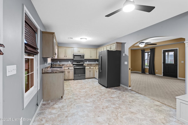 103 Maggie Ln, Bardstown, KY 40004 - kitchen featuring stainless steel appliances, a ceiling fan, arched walkways, a sink, and baseboards