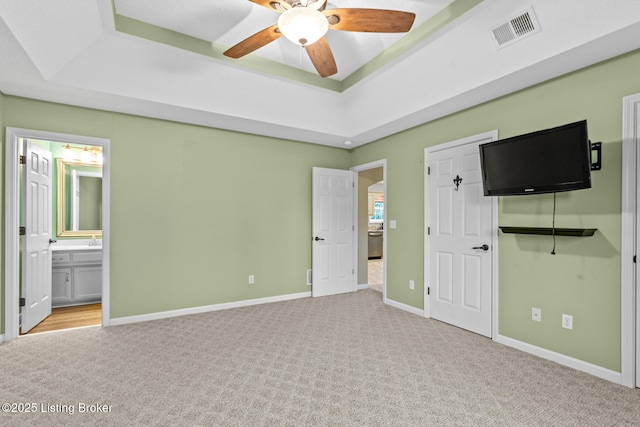 103 Maggie Ln, Bardstown, KY 40004 - unfurnished bedroom with carpet, a tray ceiling, baseboards, connected bathroom, and ceiling fan