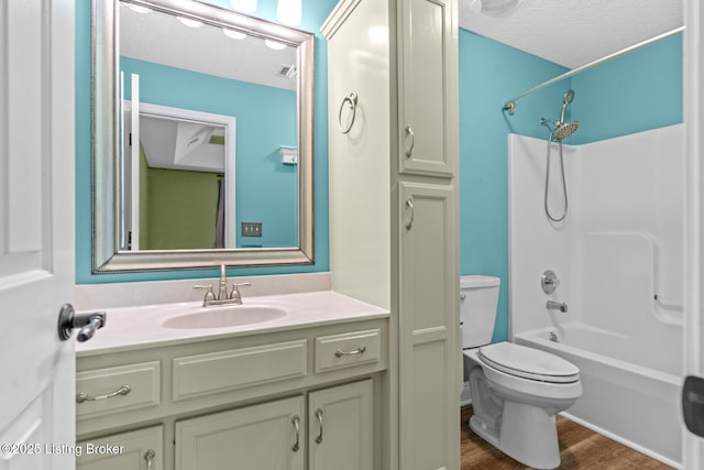 103 Maggie Ln, Bardstown, KY 40004 - bathroom with toilet, vanity, shower / bathtub combination, wood finished floors, and a textured ceiling