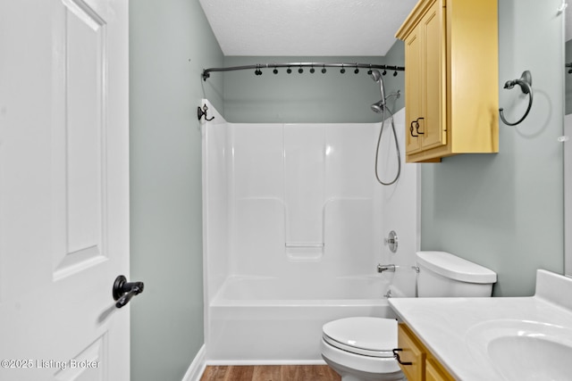 103 Maggie Ln, Bardstown, KY 40004 - bathroom featuring toilet, vanity, wood finished floors, tub / shower combination, and a textured ceiling