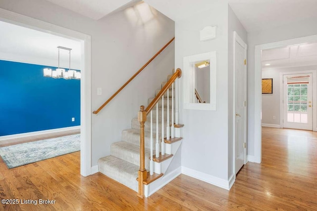 103 Deer Grove Ct, Elizabethtown, KY 42701 - stairs with wood finished floors, a chandelier, and baseboards