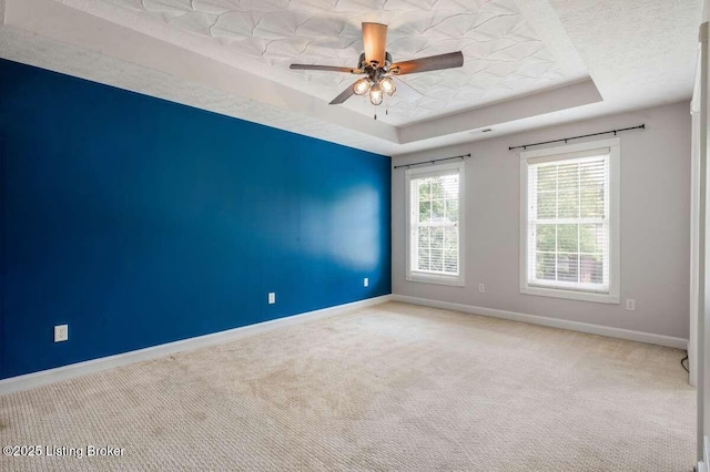 103 Deer Grove Ct, Elizabethtown, KY 42701 - carpeted spare room featuring a tray ceiling, baseboards, and ceiling fan