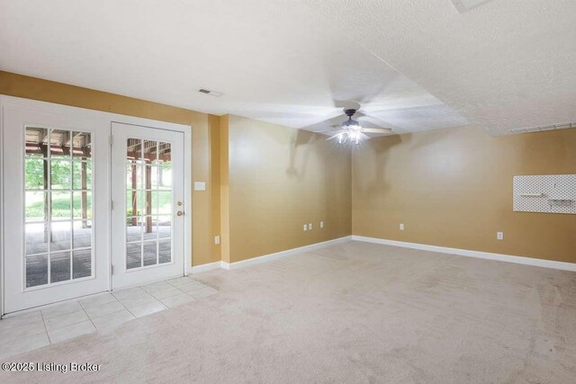 103 Deer Grove Ct, Elizabethtown, KY 42701 - empty room featuring ceiling fan, light carpet, a textured ceiling, baseboards, and light tile patterned flooring