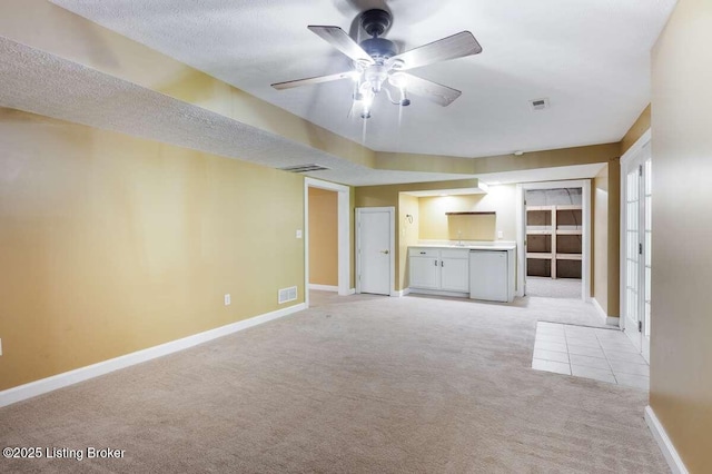 103 Deer Grove Ct, Elizabethtown, KY 42701 - unfurnished living room featuring light carpet, ceiling fan, baseboards, a textured ceiling, and light tile patterned flooring