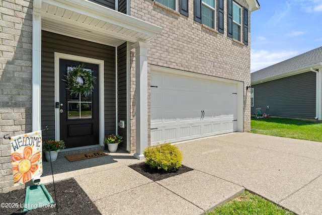 6719 Meadow Park Dr, Louisville, KY 40291 - view of exterior entry with brick siding, an attached garage, and driveway
