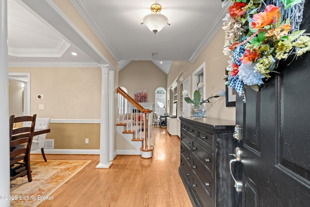 6209 Interlaken Way, Prospect, KY 40059 - foyer entrance featuring light wood finished floors, stairway, decorative columns, baseboards, and crown molding