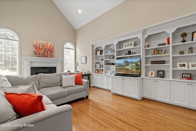 6209 Interlaken Way, Prospect, KY 40059 - living room with high vaulted ceiling, light wood finished floors, and a fireplace