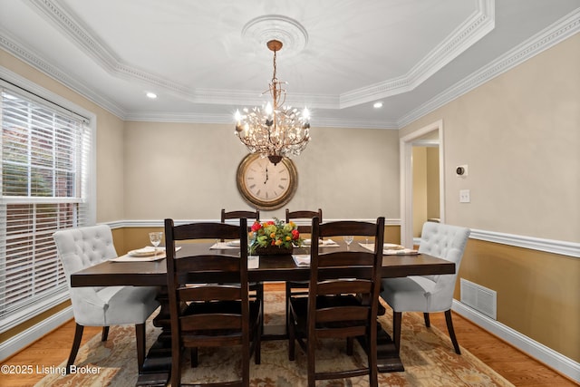 6209 Interlaken Way, Prospect, KY 40059 - dining room with wood finished floors, a raised ceiling, baseboards, a chandelier, and crown molding