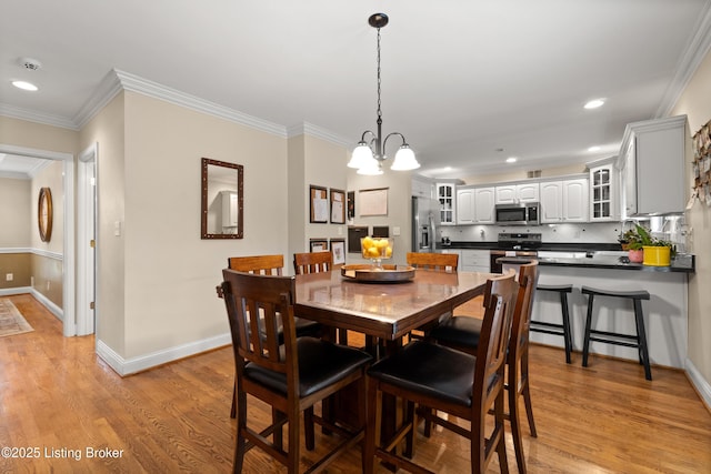 6209 Interlaken Way, Prospect, KY 40059 - dining area with crown molding, baseboards, light wood-style floors, recessed lighting, and a chandelier