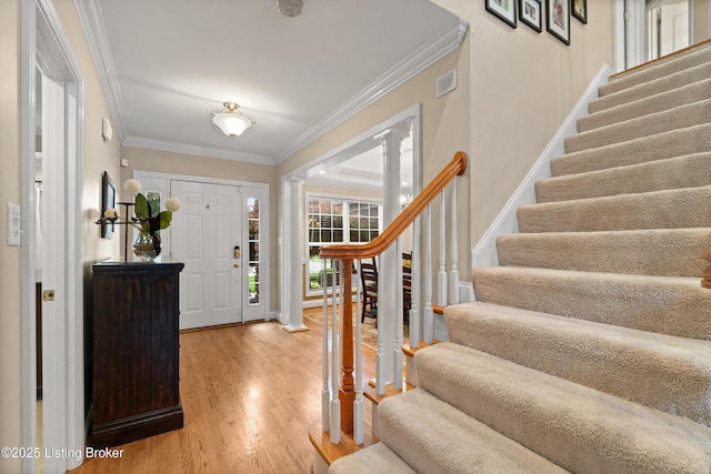 6209 Interlaken Way, Prospect, KY 40059 - foyer entrance featuring decorative columns, stairs, light wood finished floors, ornamental molding, and baseboards