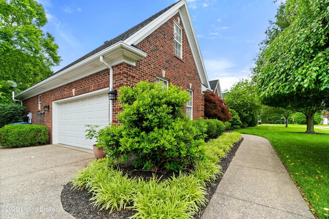 6209 Interlaken Way, Prospect, KY 40059 - view of home's exterior featuring brick siding, a yard, concrete driveway, and an attached garage