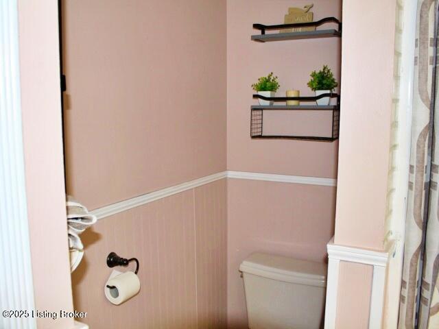 1071 Greenway Dr, Elizabethtown, KY 42701 - bathroom featuring toilet and a wainscoted wall