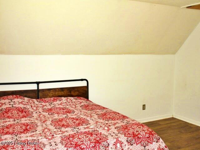 1071 Greenway Dr, Elizabethtown, KY 42701 - bedroom featuring wood finished floors, baseboards, and lofted ceiling