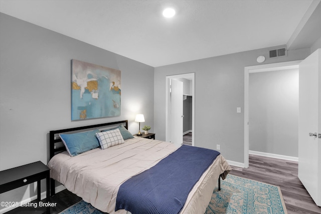 2300 Dundee Rd Unit 2, Louisville, KY 40205 - bedroom featuring wood finished floors, baseboards, and a walk in closet