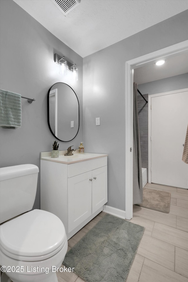 2300 Dundee Rd Unit 2, Louisville, KY 40205 - full bathroom featuring toilet, vanity, baseboards, and shower / bath combo