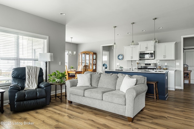 2824 Alder Wood Ln, La Grange, KY 40031 - living room featuring recessed lighting, dark wood-style flooring, baseboards, and a chandelier