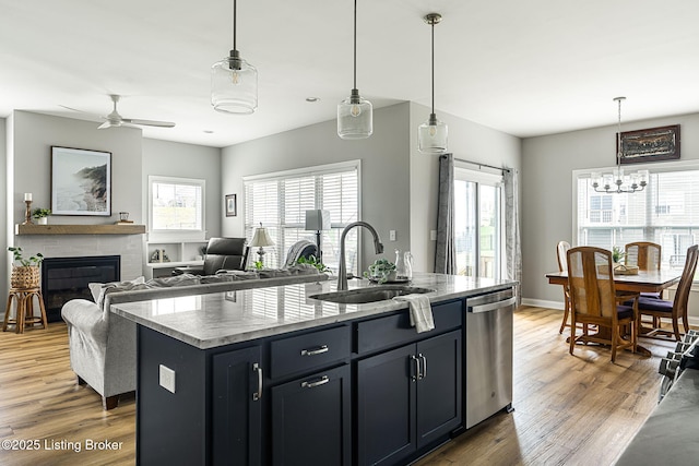 2824 Alder Wood Ln, La Grange, KY 40031 - kitchen featuring stainless steel dishwasher, a sink, a kitchen island with sink, and plenty of natural light