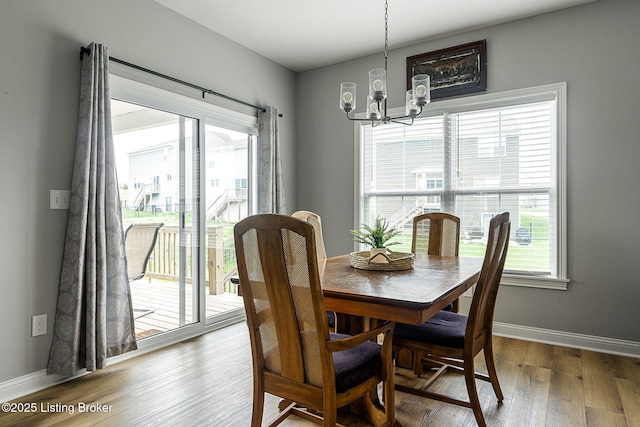2824 Alder Wood Ln, La Grange, KY 40031 - dining room with a chandelier, wood finished floors, and baseboards