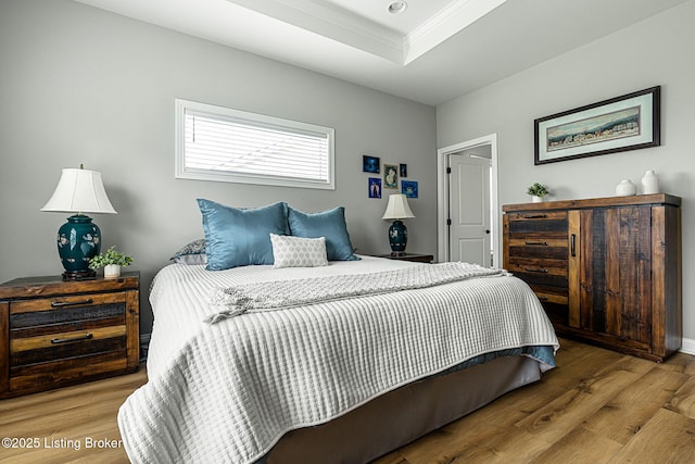 2824 Alder Wood Ln, La Grange, KY 40031 - bedroom featuring wood finished floors, ornamental molding, a tray ceiling, and baseboards