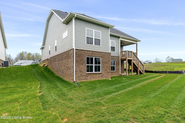2824 Alder Wood Ln, La Grange, KY 40031 - rear view of house with ceiling fan, stairs, brick siding, central AC unit, and a lawn