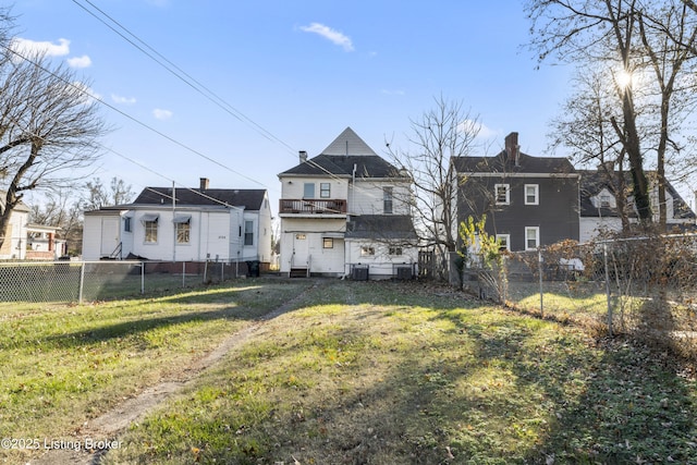 2733 Dumesnil St, Louisville, KY 40211 - back of house featuring a fenced backyard, a chimney, and entry steps