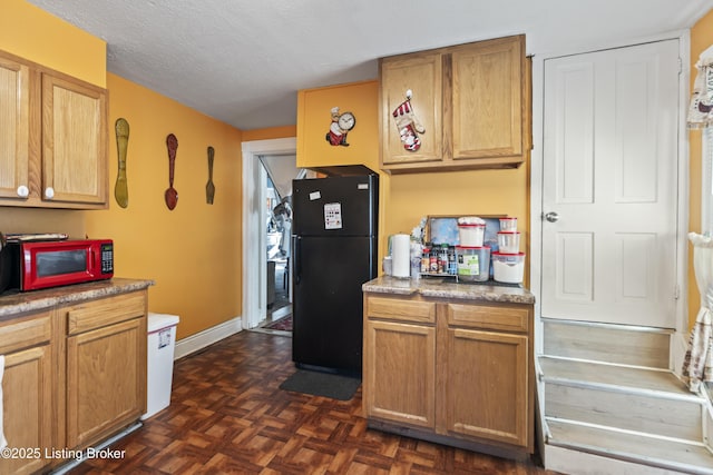 2733 Dumesnil St, Louisville, KY 40211 - kitchen featuring freestanding refrigerator, a textured ceiling, and light countertops