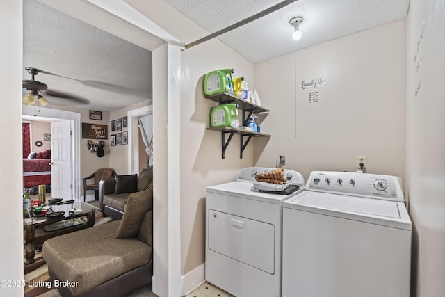 2733 Dumesnil St, Louisville, KY 40211 - laundry room with washing machine and dryer, a textured ceiling, and a ceiling fan