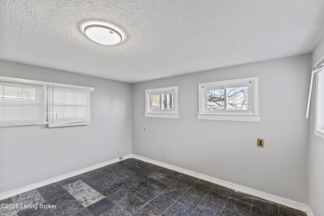 2733 Dumesnil St, Louisville, KY 40211 - spare room featuring a textured ceiling