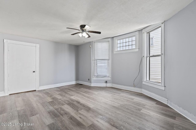 2733 Dumesnil St, Louisville, KY 40211 - unfurnished room featuring a ceiling fan, wood finished floors, and a textured ceiling