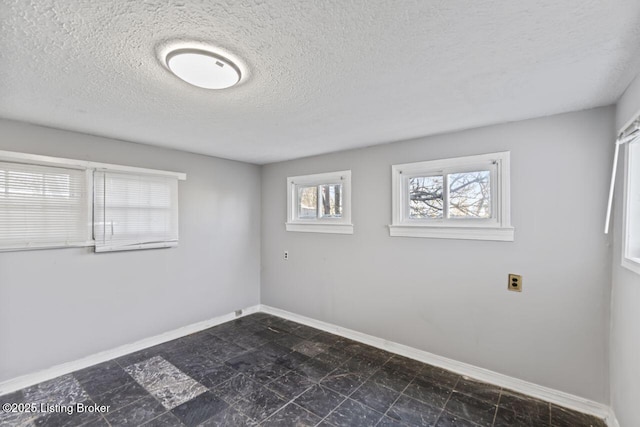 2733 Dumesnil St, Louisville, KY 40211 - unfurnished room featuring baseboards and a textured ceiling