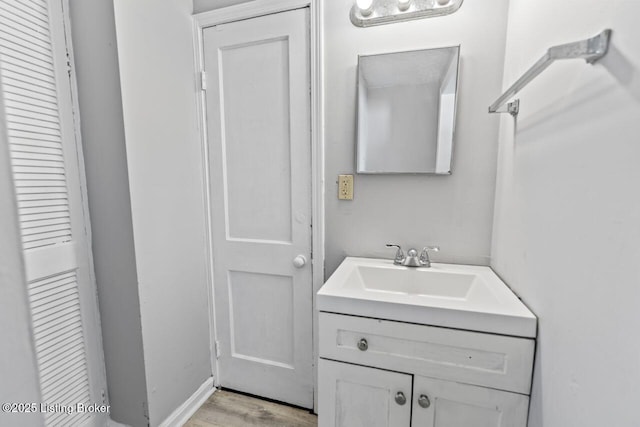 2733 Dumesnil St, Louisville, KY 40211 - bathroom featuring vanity and wood finished floors