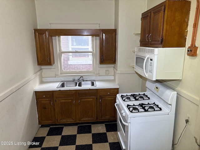 3 Eutropia Ct, Louisville, KY 40208 - kitchen with white appliances, a sink, tile patterned floors, and light countertops
