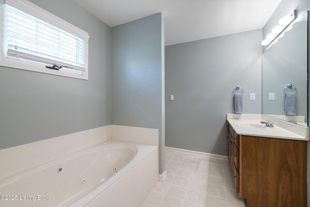 1400 Nightingale Ln, Goshen, KY 40026 - bathroom featuring vanity, a jetted tub, baseboards, and tile patterned flooring