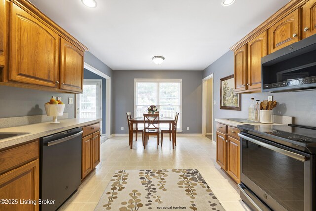 1400 Nightingale Ln, Goshen, KY 40026 - kitchen with stainless steel appliances, light countertops, brown cabinets, and recessed lighting