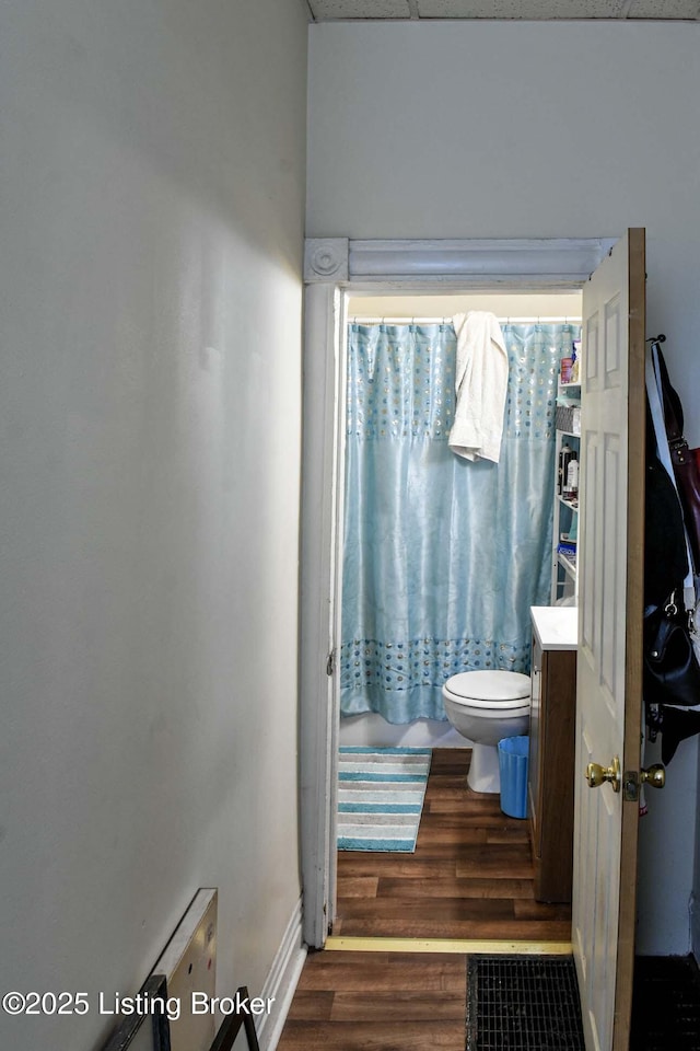 513 Camp St, Louisville, KY 40203 - full bathroom featuring toilet, wood finished floors, baseboards, and vanity
