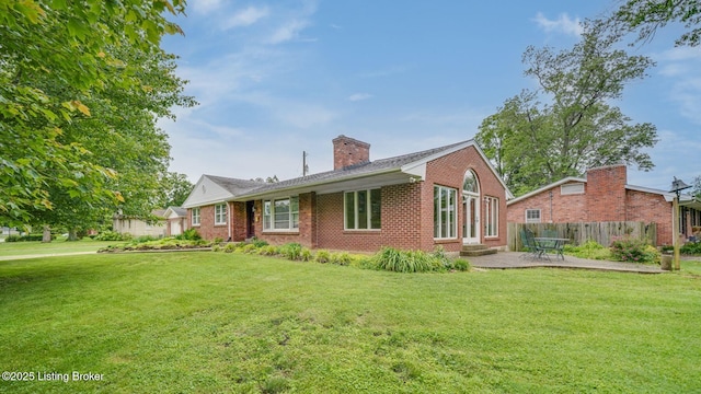 316 Short Rd, Louisville, KY 40207 - view of front of home featuring brick siding, a chimney, and a patio