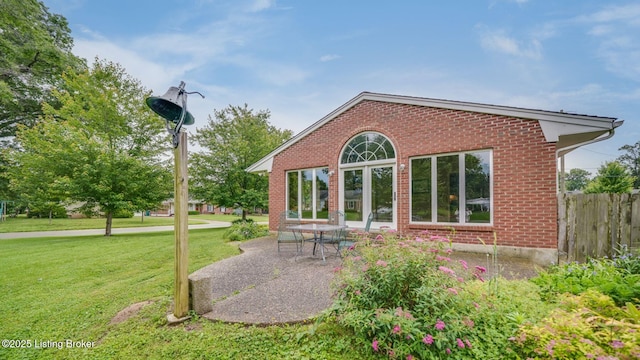 316 Short Rd, Louisville, KY 40207 - back of property featuring brick siding and a patio