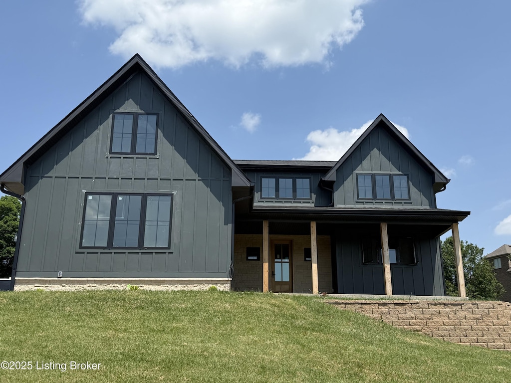 6609 Clore Lake Rd, Crestwood, KY 40014 - modern farmhouse style home featuring board and batten siding, a front yard, and covered porch