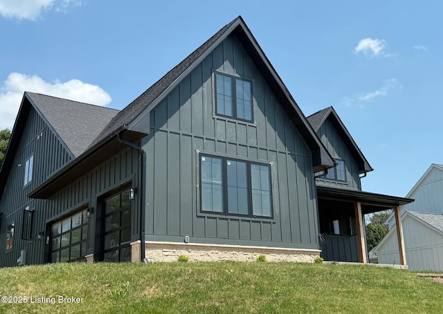 6609 Clore Lake Rd, Crestwood, KY 40014 - back of property featuring board and batten siding, a shingled roof, and a lawn