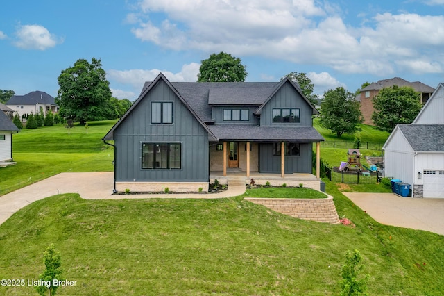 6609 Clore Lake Rd, Crestwood, KY 40014 - modern farmhouse with board and batten siding, covered porch, a front yard, and a shingled roof
