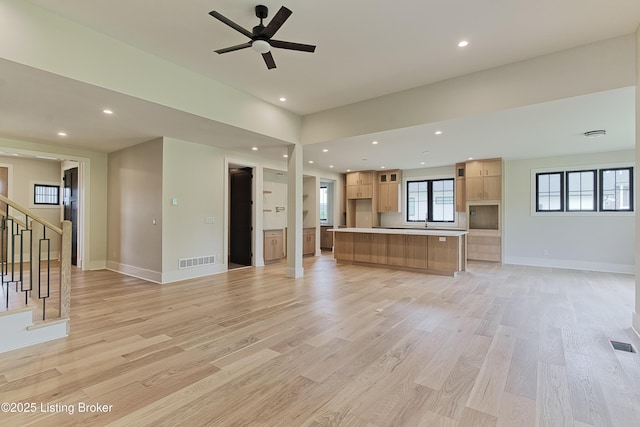 6609 Clore Lake Rd, Crestwood, KY 40014 - unfurnished living room featuring light wood-type flooring, stairway, a ceiling fan, and recessed lighting