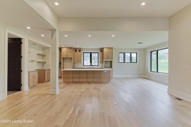 6609 Clore Lake Rd, Crestwood, KY 40014 - kitchen with light wood finished floors, light brown cabinetry, healthy amount of natural light, a large island, and recessed lighting