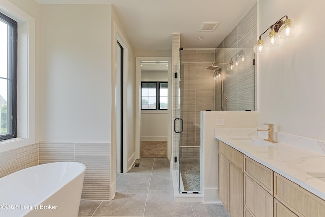 6609 Clore Lake Rd, Crestwood, KY 40014 - bathroom featuring a stall shower, a freestanding bath, tile patterned flooring, and double vanity