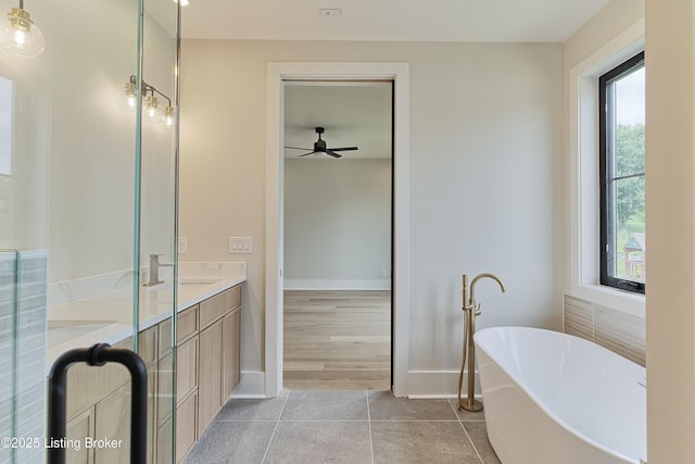 6609 Clore Lake Rd, Crestwood, KY 40014 - full bath with a soaking tub, double vanity, tile patterned floors, and ceiling fan