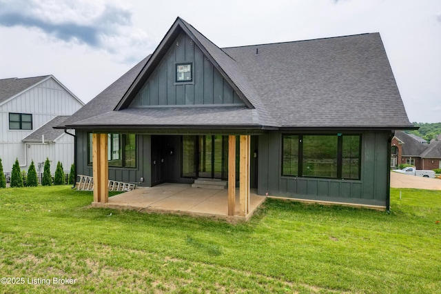 6609 Clore Lake Rd, Crestwood, KY 40014 - rear view of house with board and batten siding, a shingled roof, a patio, and a lawn