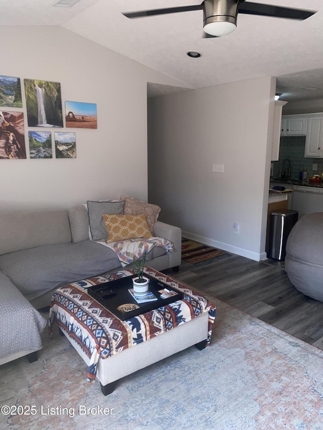 11919 Tazwell Dr Unit 7, Louisville, KY 40245 - living area featuring wood finished floors, baseboards, and lofted ceiling