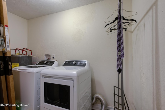 14499 S S Highway 259, Leitchfield, KY 42754 - washroom with separate washer and dryer and a textured ceiling