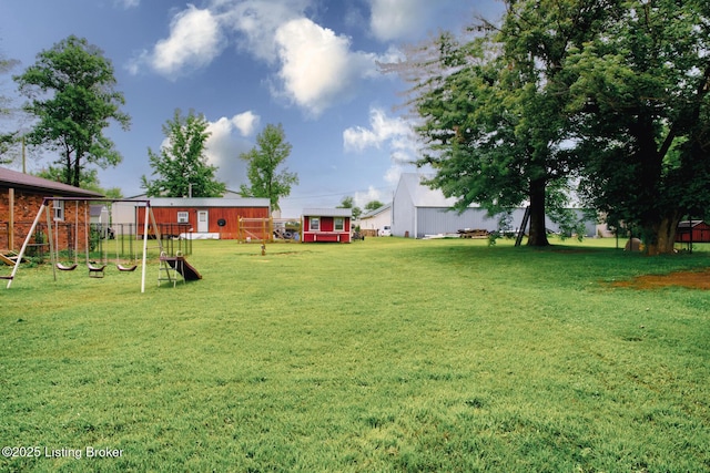 14499 S S Highway 259, Leitchfield, KY 42754 - view of grassy yard with a playground and an outdoor structure