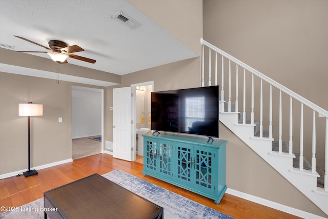 204 Greenleaf Dr, Elizabethtown, KY 42701 - living area featuring ceiling fan, wood finished floors, stairs, and baseboards